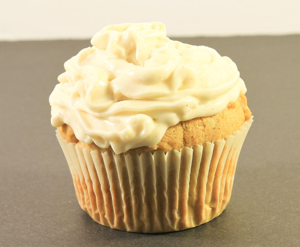 Pumpkin Muffin with Frosting on table