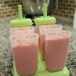 Strawberry Popsicles in popsicle molds before freezing