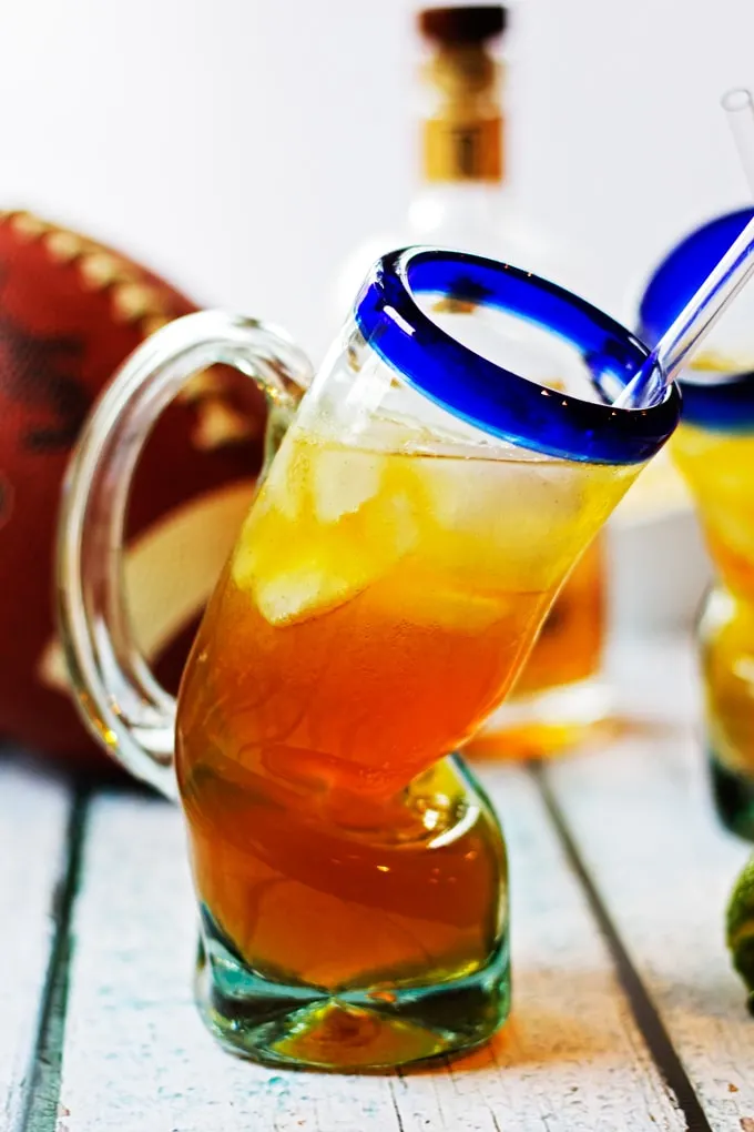 Whiskey Beer Lemonade in fun beer glass with football in background