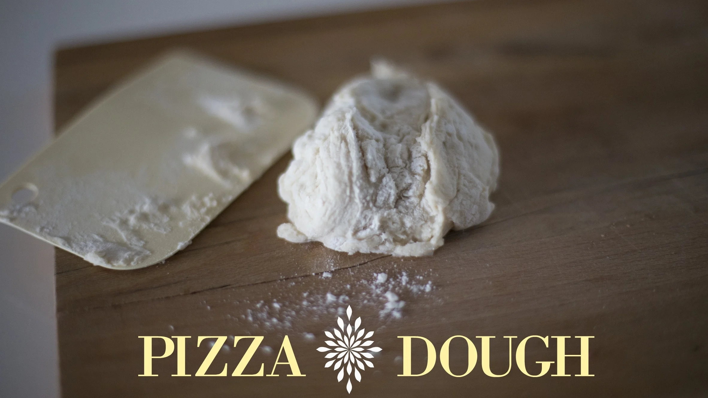 Dough on cutting board sprinkled with flour