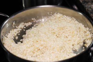Arborio rice toasting in skillet