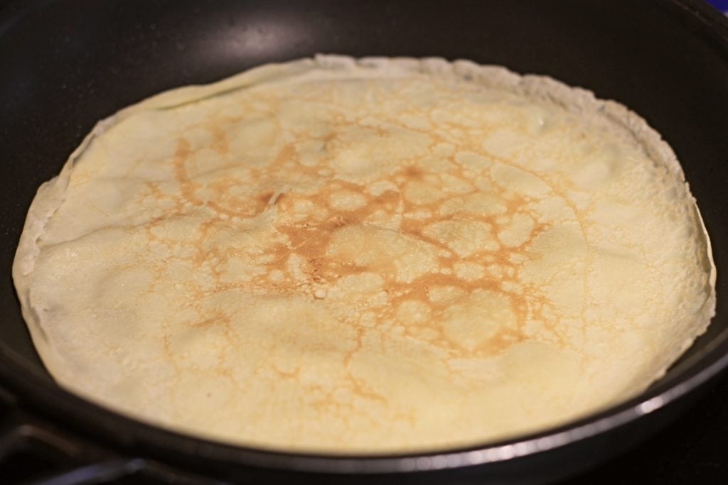 Single Crepe cooking in pan
