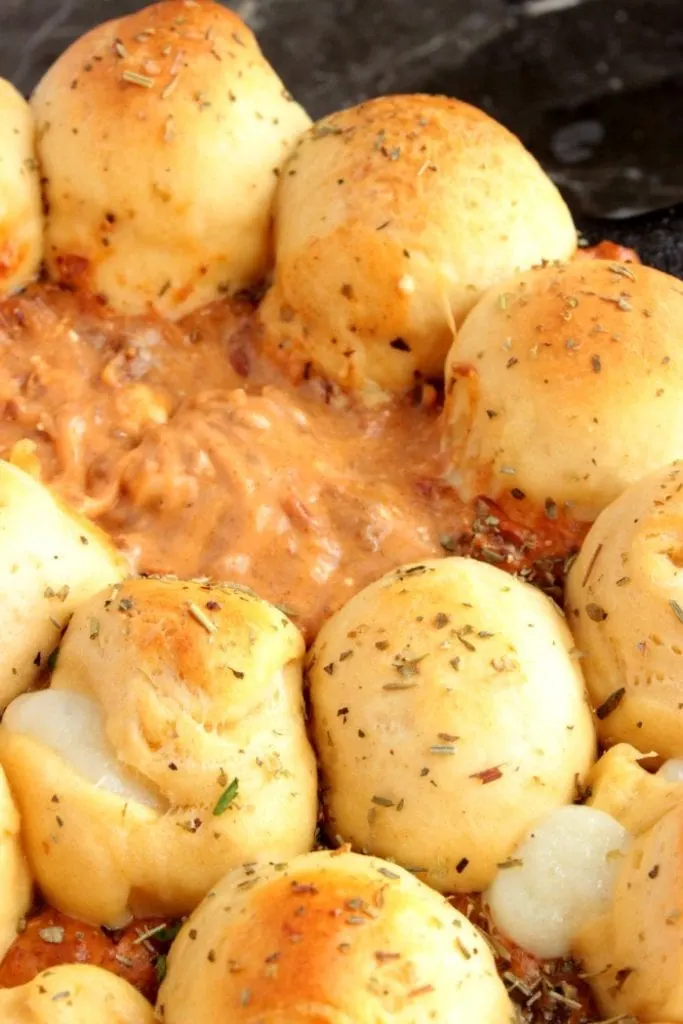 Ooey Chili Dip in the center of a pull apart bread bowl