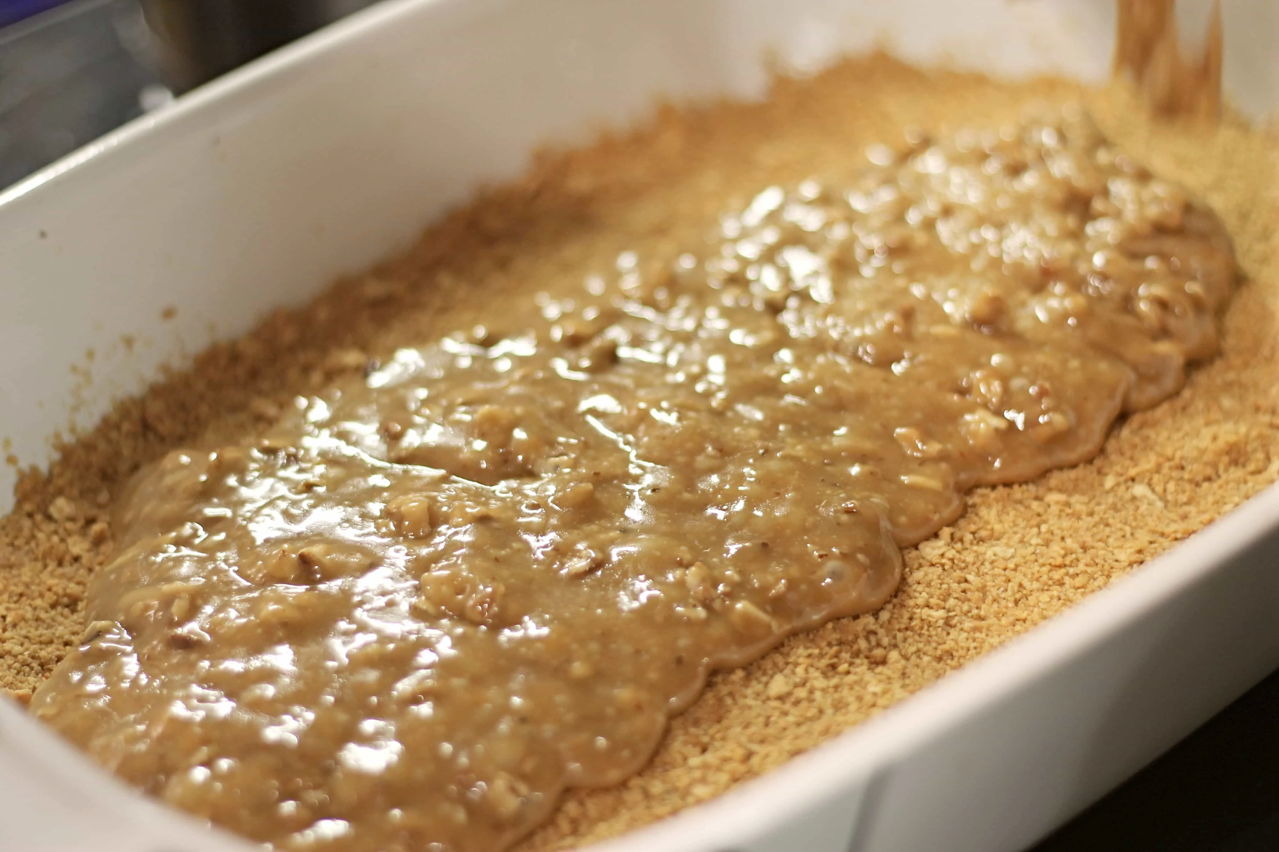 Poured toffee over graham crust for toffee bar recipe