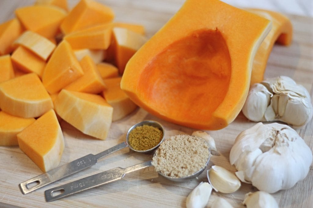 Ingredients for Butternut Squash Soup on wooden cutting board