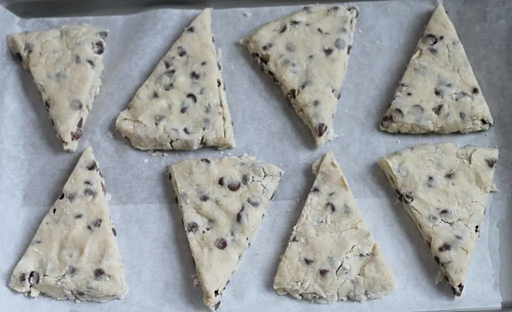 uncooked chocolate chip scones on baking sheet
