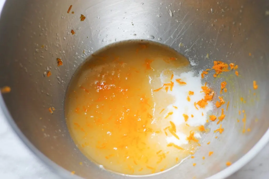 Mixing bowl with citrus juice, zest and sugar 