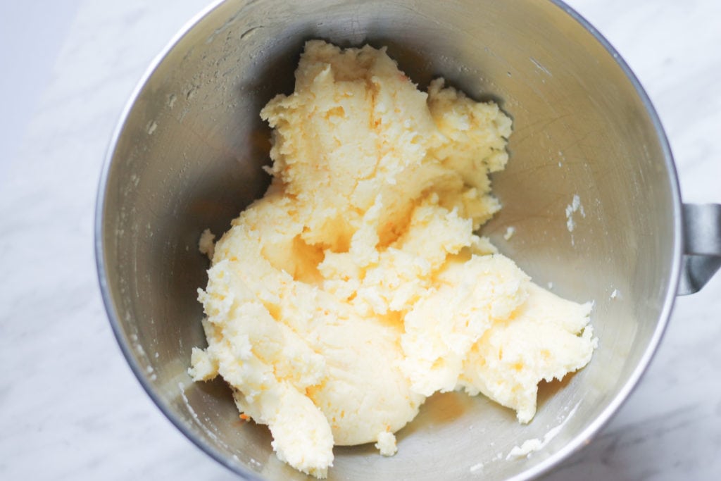 Whipped butter and sugar in mixing bowl 