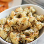 cooked cauliflower in white serving bowl
