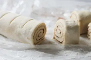 Roll of cinnamon buns cut into sections