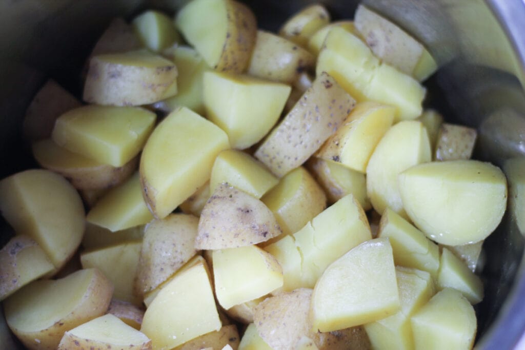 Cooked, chopped potatoes in instant pot. 