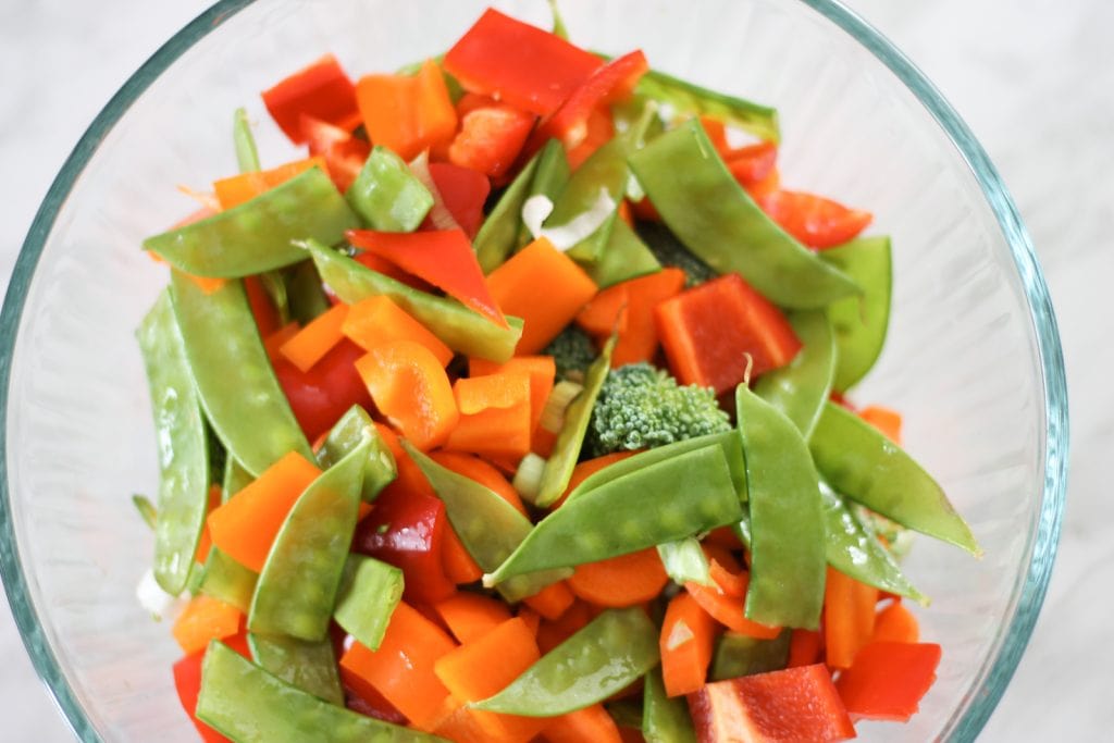 Glass bowl with vegetables for stir-fry before cooking