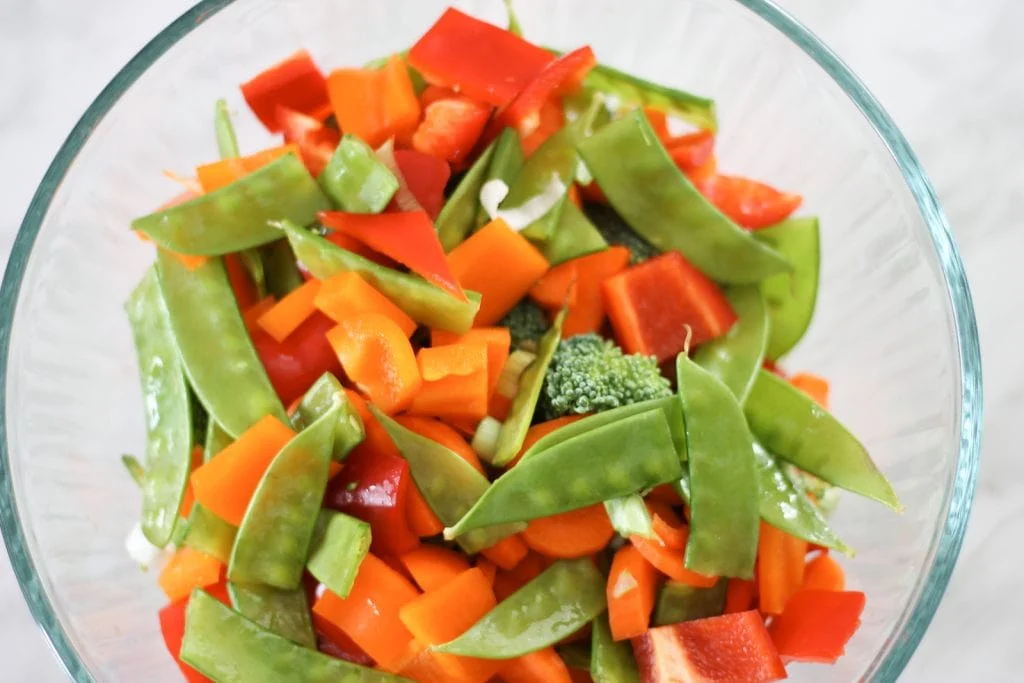 Glass bowl with vegetables for stir-fry before cooking